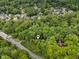 Aerial view of wooded neighborhood with tree coverage providing privacy at 8310 Fall Creek Rd, Indianapolis, IN 46256