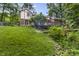 View of a home's back exterior and backyard space at 8310 Fall Creek Rd, Indianapolis, IN 46256