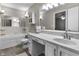 Comfortable bathroom featuring a large tub, vanity, and marble countertops at 8310 Fall Creek Rd, Indianapolis, IN 46256