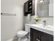 Functional bathroom featuring a vanity sink, and a large mirror at 8310 Fall Creek Rd, Indianapolis, IN 46256