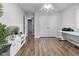 Spacious bedroom with wood floors, a ceiling fan, and natural light at 8310 Fall Creek Rd, Indianapolis, IN 46256