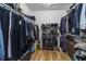 Walk-in closet with racks and shelves to maximize organization and storage at 8310 Fall Creek Rd, Indianapolis, IN 46256