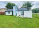 Spacious backyard featuring a white fence, well-maintained lawn and a patio area at 8318 Rob Ln, Indianapolis, IN 46237