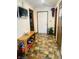 Inviting entryway with patterned tile floors, wooden bench, and access to multiple rooms at 8318 Rob Ln, Indianapolis, IN 46237