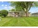View of a stone exterior and large shade tree at 861 Westbrook Dr, Mooresville, IN 46158