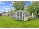 This backyard shows 2 storage sheds with green grass at 861 Westbrook Dr, Mooresville, IN 46158