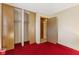 Spacious bedroom featuring a closet, red carpet, and neutral-toned walls at 861 Westbrook Dr, Mooresville, IN 46158