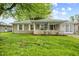 Charming single-story home with stone facade, manicured lawn, and covered porch at 861 Westbrook Dr, Mooresville, IN 46158