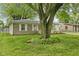 Charming home with well-kept lawn and mature tree providing shade and curb appeal at 861 Westbrook Dr, Mooresville, IN 46158