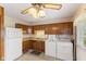 Cozy kitchen features wood cabinets, laminate countertops, and convenient washer/dryer hookups at 861 Westbrook Dr, Mooresville, IN 46158