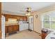 Functional kitchen featuring classic wood cabinets, and adjacent laundry area for convenience at 861 Westbrook Dr, Mooresville, IN 46158