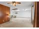 Spacious living area with unique ceiling fixtures, cozy carpet, and access to dining area at 861 Westbrook Dr, Mooresville, IN 46158