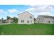 The property's spacious backyard features a patio, seating, and lush lawn at 8690 Lester Pl, Pendleton, IN 46064