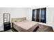 Cozy bedroom features plush carpet, neutral walls, and a comfortable bed with stylish headboard at 8690 Lester Pl, Pendleton, IN 46064
