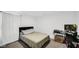 Modern bedroom is designed with neutral colors and a well-lit space, featuring a plush bed at 8690 Lester Pl, Pendleton, IN 46064
