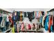 Large walk-in closet full of clothing, shoes, and accessories at 8690 Lester Pl, Pendleton, IN 46064