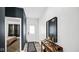 Inviting entryway with neutral tones, a modern mirror, and a view into the bedroom at 8690 Lester Pl, Pendleton, IN 46064