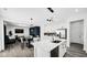 Open concept kitchen island view of the dining area and living room with modern décor and appliances at 8690 Lester Pl, Pendleton, IN 46064