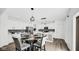 Bright kitchen features a breakfast nook with stylish chairs, modern appliances, and white cabinetry at 8690 Lester Pl, Pendleton, IN 46064