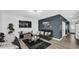 Contemporary living room showcasing comfortable seating, a large TV, and fashionable decor at 8690 Lester Pl, Pendleton, IN 46064