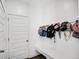 Organized mudroom with a bench, coat hooks, and storage, perfect for keeping things tidy at 8690 Lester Pl, Pendleton, IN 46064