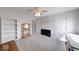 Bright bedroom features a ceiling fan, bookcase, display case, and plush carpeting at 8720 Yardley Ct # 207, Indianapolis, IN 46268