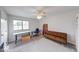 Neutral bonus room offering adaptable space for work or relaxation, with natural lighting and comfortable seating at 8720 Yardley Ct # 207, Indianapolis, IN 46268