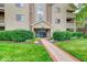 Well-maintained building exterior with landscaping and clear signage at 8720 Yardley Ct # 207, Indianapolis, IN 46268