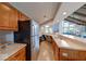 Functional kitchen area with modern appliances and ample counter space that opens up to the living area at 8720 Yardley Ct # 207, Indianapolis, IN 46268