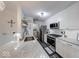 Updated kitchen featuring stainless steel appliances, white cabinets, and granite countertops at 8720 Yardley Ct # 207, Indianapolis, IN 46268