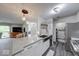 Modern kitchen with stainless steel appliances and an eat-in bar that opens to the living room at 8720 Yardley Ct # 207, Indianapolis, IN 46268
