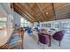Open living space featuring a wooden ceiling, ample natural light, comfortable seating, and bar seating at 8720 Yardley Ct # 207, Indianapolis, IN 46268