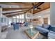 An open-concept living area with a wooden ceiling, a view of the pool, and stylish furniture arrangements at 8720 Yardley Ct # 207, Indianapolis, IN 46268