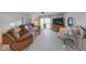 Comfortable living room with a ceiling fan and sliding doors to the outside patio at 8720 Yardley Ct # 207, Indianapolis, IN 46268