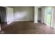 Vacant bedroom with closet, view to hallway, and sliding glass door in the background at 9045 Stardust Dr, Indianapolis, IN 46229