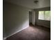 Cozy bedroom featuring natural light, neutral paint, and closet for storage at 9045 Stardust Dr, Indianapolis, IN 46229