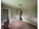 Vacant carpeted bedroom with two closets and entry doorway at 9045 Stardust Dr, Indianapolis, IN 46229