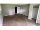 A vacant bedroom with a standard closet, wood paneling and neutral paint at 9045 Stardust Dr, Indianapolis, IN 46229