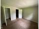 Cozy bedroom with closet, neutral walls, and wall-to-wall carpeting at 9045 Stardust Dr, Indianapolis, IN 46229