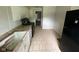 Kitchen features tile flooring and white cabinetry at 9045 Stardust Dr, Indianapolis, IN 46229
