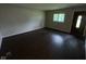 Bright living room features hardwood floors and large windows for natural light at 9045 Stardust Dr, Indianapolis, IN 46229
