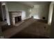 Cozy living room with a stone fireplace and views of the backyard at 9045 Stardust Dr, Indianapolis, IN 46229