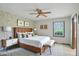 Beautifully staged bedroom with accent wall, modern furniture, and natural lighting at 9101 Ditch Rd, Indianapolis, IN 46260