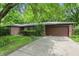 A single-story brick home with an attached garage and well-kept lawn at 9101 Ditch Rd, Indianapolis, IN 46260