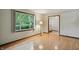 Cozy living room with hardwood floors and a large window with a view of the yard at 9101 Ditch Rd, Indianapolis, IN 46260