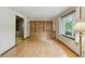 Spacious room with hardwood floors, built-in bookshelves and a large window at 9101 Ditch Rd, Indianapolis, IN 46260