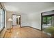 Bright living room featuring hardwood floors and a view to the yard at 9101 Ditch Rd, Indianapolis, IN 46260