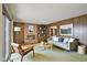 Stylish living room with wood paneling, a fireplace, and comfortable seating at 9101 Ditch Rd, Indianapolis, IN 46260