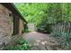 Private brick patio with mature plants and access to backyard and slider door at 9101 Ditch Rd, Indianapolis, IN 46260