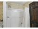 Bathroom shower with patterned wallpaper and installed shower head at 9101 Ditch Rd, Indianapolis, IN 46260